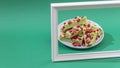 Fudge, sweet candies, handmade dessert made of white chocolate, matcha tea and strawberries on a bright background. Royalty Free Stock Photo