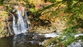 Fudo stream and the red bridge at Mount Nakano-Momiji Royalty Free Stock Photo