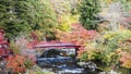 Fudo stream and the red bridge at Mount Nakano-Momiji Royalty Free Stock Photo