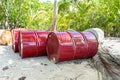 Oil drum barrels on beach in french polynesia Royalty Free Stock Photo