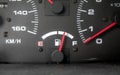 Fuel indicator needle in focus ,dirty dashboard Royalty Free Stock Photo