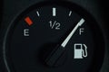 The fuel level indicator on the dashboard is at the full tank mark, close-up