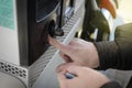 Fuel prices for cars. A woman pays for gasoline at a gas station with a bank card Royalty Free Stock Photo