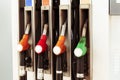 Fuel pumps,in different colors, at a gas station Royalty Free Stock Photo