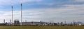 Fuel refinery with chimney and furnace. Blue sky overhead