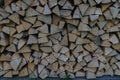 Fuel for stove heating at home and bath. Rural life. Wooden firewood is laid in the walls. Natural wood Royalty Free Stock Photo