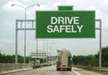 Fuel Tanker Truck and Drive Safely Sign Royalty Free Stock Photo