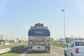Fuel transportation, YPF tanker truck driving on a highway, seen from behind