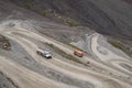 Fuel truck on dangerous gravel mountain road transporting diesel fuel to Kumtor gold mine. Industry freight truck transportation