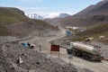 Fuel truck on dangerous gravel mountain road transporting diesel fuel to Kumtor gold mine. Industry freight truck transportation