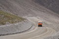 Fuel truck on dangerous gravel mountain road transporting diesel fuel to Kumtor gold mine. Industry freight truck transportation