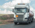 Fuel truck is moving along a country road Royalty Free Stock Photo