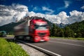 Fuel truck rushes down the highway in the background the Alps. Truck Car in motion blur Royalty Free Stock Photo