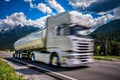 Fuel truck rushes down the highway in the background the Alps. T Royalty Free Stock Photo