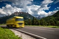 Fuel truck rushes down the highway in the background the Alps. Truck Car in motion blur