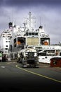 Fuel trucks fuelling cruise ships and war ships at the docks of a Canadian harbour.