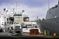 Fuel trucks fuelling cruise ships and war ships at the docks of a Canadian harbour.