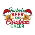 Fueled by beer and Christmas cheer - funny text , with Santa`s cap on beer mug.