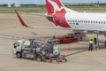 Fuelling vehicle pumping fuel into Qantas aircraft at Brisbane Airport