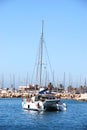 Catamaran at anchor in the harbour, Fuengirola, Spain.