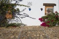 Fuente Palmera whitewashed walls and windows full of flowers, Cordoba, Spain