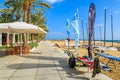 FUERTEVENTURA, CANARY ISLANDS, SPAIN - FEB 7, 2014: promenade along sandy beach in Morro Jable town. Many tourists visit the Royalty Free Stock Photo