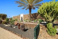 Canary style buildings and tropical plants in La Oliva village Heritage Art Center, Fuerteventura, Canary Islands, Spain Royalty Free Stock Photo