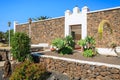 Canary style buildings and tropical plants in La Oliva village Heritage Art Center, Fuerteventura, Canary Islands, Spain Royalty Free Stock Photo