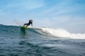 Fuerteventura - September 29, 2019: surfer riding waves on the island of fuerteventura in the Atlantic Ocean