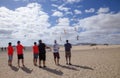 FUERTEVENTURA, SPAIN - NOVEMBER 10: A group of kite enthusiast fly their kites in formation at 31th International Kite Festival,