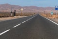 Fuerteventura, Spain - October 3 2023: Long straight road in the middle of Canary desert