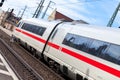 ICE 3, intercity-Express train from Deutsche Bahn passes train station Royalty Free Stock Photo