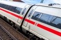 ICE 3, intercity-Express train from Deutsche Bahn passes train station Royalty Free Stock Photo