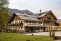 FUESSEN, BAVARIA, GERMANY - OCTOBER 10, 2017: Hotel with restaurant in the shape of a large traditional Bavarian house against the Royalty Free Stock Photo