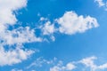 Fuffy clouds on bright blue sky background Royalty Free Stock Photo