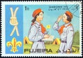 FUJAIRAH EMIRATE - CIRCA 1971: A stamp printed in United Arab Emirates shows scouts and knot, circa 1971.