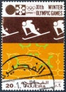 FUJAIRAH EMIRATE - CIRCA 1972: A stamp printed in United Arab Emirates shows Slalom skier, circa 1972. Royalty Free Stock Photo