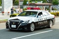 Tokyo 2020 Olympic Torch Relay. Car parade with police car ensuring safety in Fuji City, Japan. Close-up