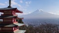 Fuji mountain behind red pagoda temple