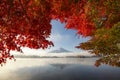 Fuji Mountain Reflection and Red Maple Leaves  with Morning Mist at Sunrise, Kawaguchiko Lake, Japan Royalty Free Stock Photo