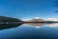 Fuji mountain reflections, first snow in autumn season and ducks swimming at Tanuki Lake(Tanukiko). Japan Royalty Free Stock Photo