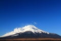 Fuji mountain with snow and fog covered top and clear blue sky background with above copy space. Royalty Free Stock Photo