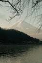 Fuji mountain view and Kawaguchiko lake with tree branch in morning sunrise, winter seasons at yamanachi, Japan.