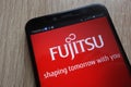 Fujitsu logo displayed on a modern smartphone