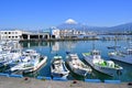 Fujiyama, Japan, April 10, 2023 : Fuji Mountain and Fisherman boats with Japan industry factory area background view from