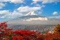 Fujiyoshida, Japan with fall foliage surrounding Mt. Fuji Royalty Free Stock Photo