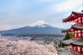 Fujiyoshida landmark of Japan Chureito res Pagoda on Fuji mountain background,Red Pagoda in spring season with sakura tress full b Royalty Free Stock Photo