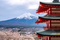 Fujiyoshida landmark of Japan Chureito res Pagoda on Fuji mountain background,Red Pagoda in spring season with sakura tress full b Royalty Free Stock Photo