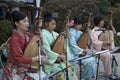 Ladies band in kimono playing the biwa musical instrument for the Hakata Tomyo Watching