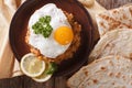 Ful medames with a fried egg and bread close-up. horizontal top Royalty Free Stock Photo